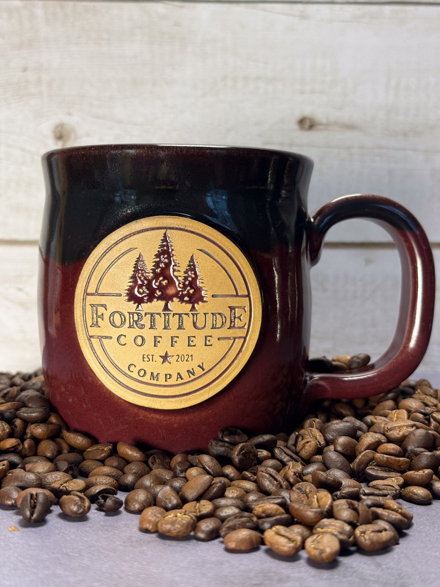Handmand Ceramic Mug with red and black glaze and fortitude coffee logo
